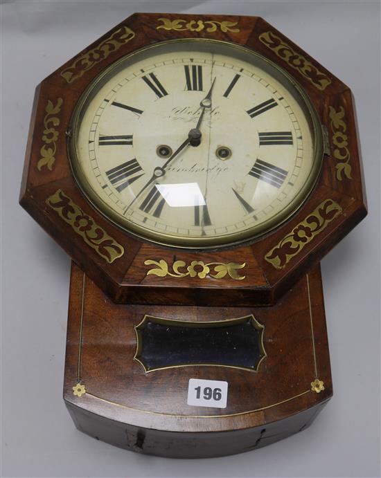 An early Victorian brass inset wall clock